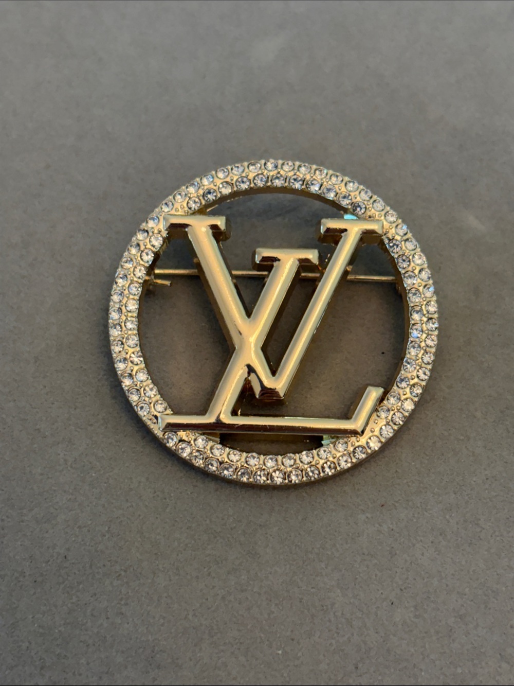 Gold and Clear Crystal Round Logo Brooch